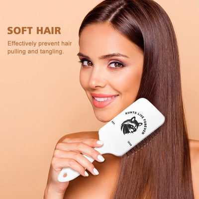 Woman using white air cushion scalp massage brush for soft hair, preventing hair pulling and tangling