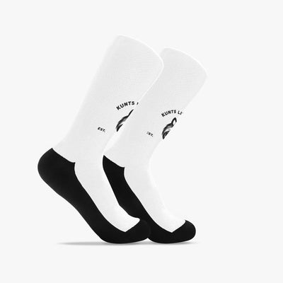 Pair of white and black Reinforced Coon Sports Socks with branded design on the calf.
