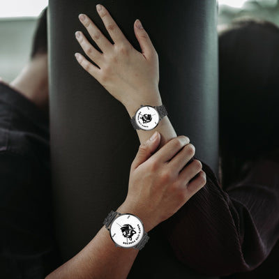 Steel Strap Quartz watch with a black metal band and a white dial featuring a rebellious punk skull design.